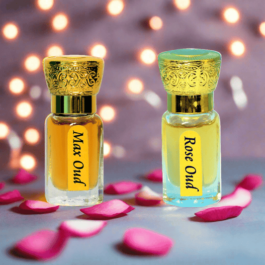 Two perfume bottles labeled 'Max Oud' and 'Rose Oud' with pink petals on a blurred lights background.